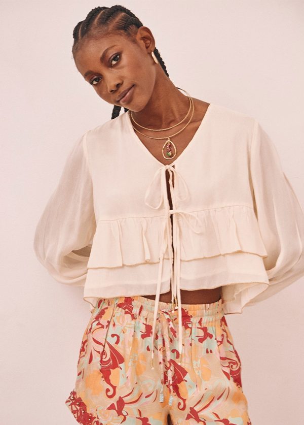 Blusa manga larga con volantes detalle lurex